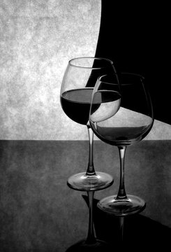 Still life with glass goblets on a gray background