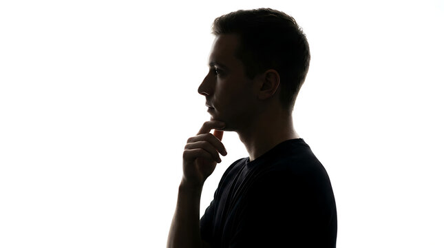 Silhouette of a pensive man in profile thinking deeply against a clean white background