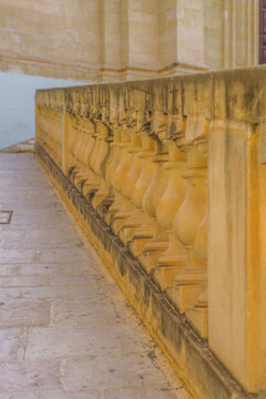 Yellow Limestone Balustrade Railing Beside Flagstone Paved Walkway, Close Up Architectural Perspective