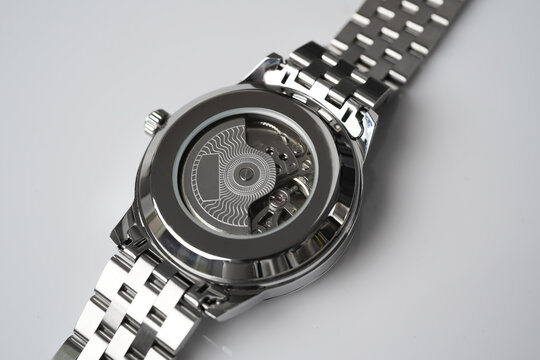 Automatic Mechanical Watch Movement with Visible Rotor Through Transparent Caseback in Macro Close Up