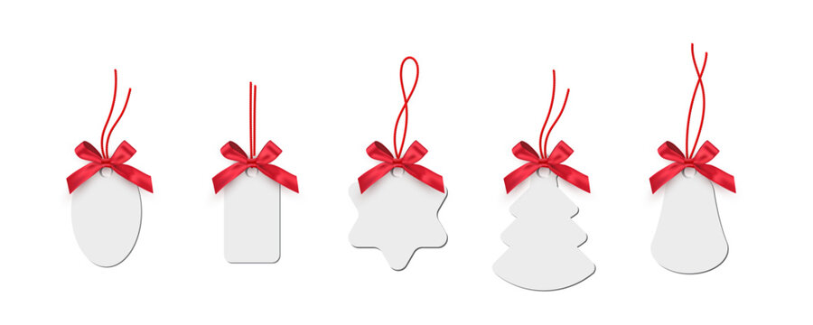Christmas gift tags with ribbons. Winter holidays decorations. Paperboard various shapes pendants collection isolated on transparent. Shopping special offers stickers. Festive vector illustration