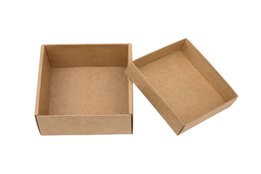 Two empty brown cardboard boxes, one open and one with its lid slightly askew, are isolated on a clean white background