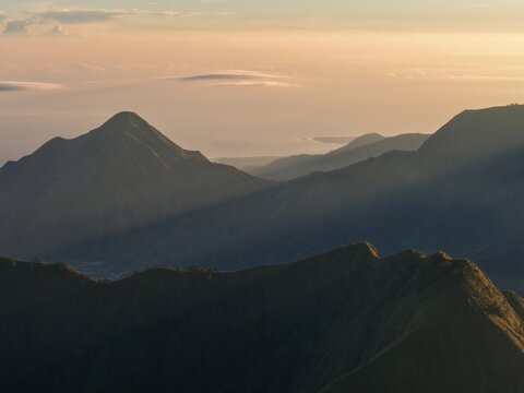Stunning Sunrise View Over the Majestic Ridges of Bukit Pergasingan in Lombok, Indonesia