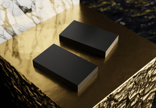 Two black business card stacks on gold and marble display. 3d rendering