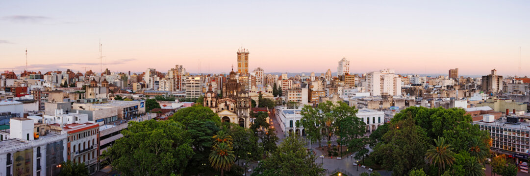 Cityscape with urban park and historic church at sunset argentina