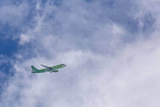 The green plane is gaining altitude