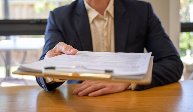 Businessman hand holding or handing over document, approval documentation agreement, document data management system, Document data system Report HR technology Concept