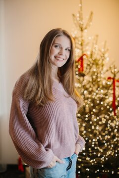 Young woman smiling celebrating happy christmas holidays