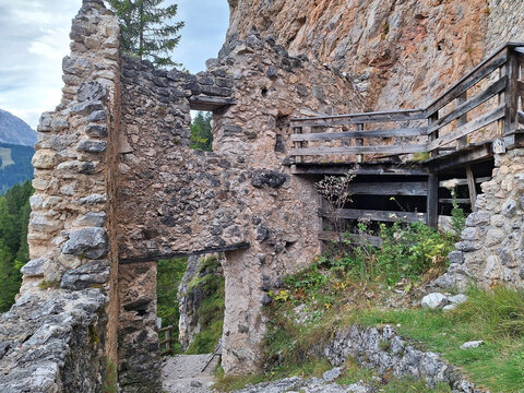 The ruins of the stone castle Wolkenstein in a mountain near the town of Selva val Gardena.