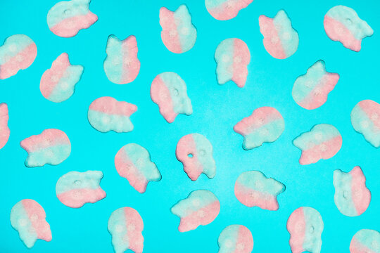 Pink and blue skull candy covers a bright blue background