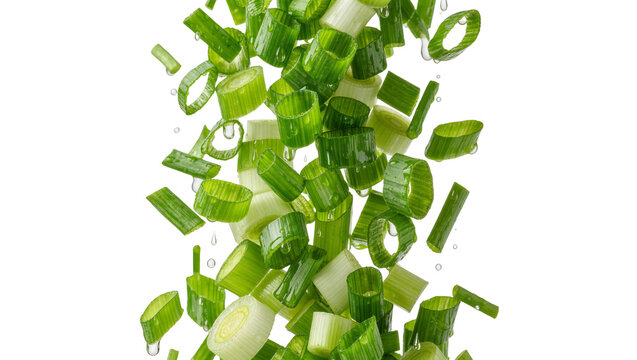Fresh chopped green onion scallion slices falling with water droplets