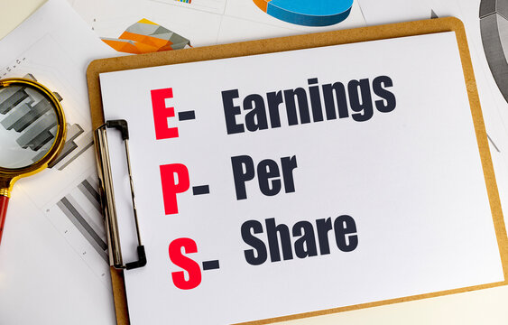  Earnings per share financial analysis with magnifying glass, clipboard, charts and report