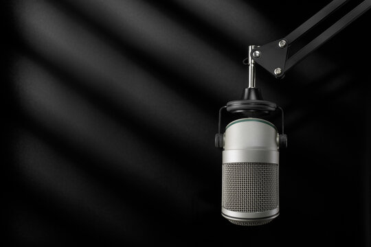 Studio microphone in a dark recording studio