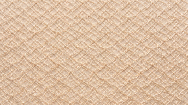 Beige knitted mesh fabric texture background close up detailing woven textile pattern and fiber loop
