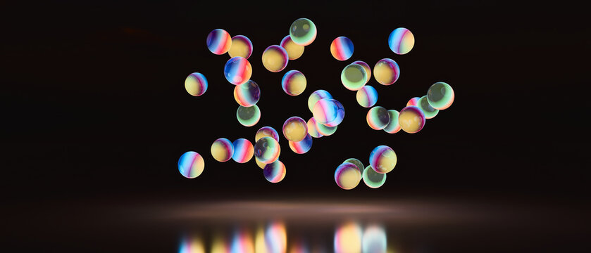 Panoramic band of small 3D glowing beads over black water