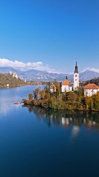 Church on the pilgrimage island in the middle of lake bled slovenia an aerial