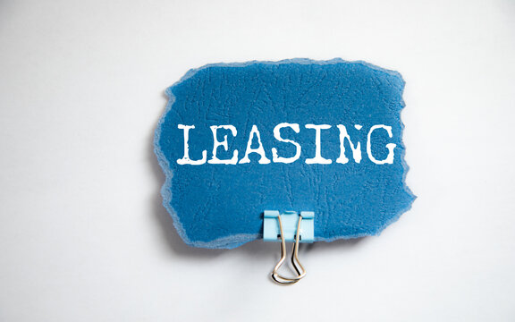 LEASING word on white paper