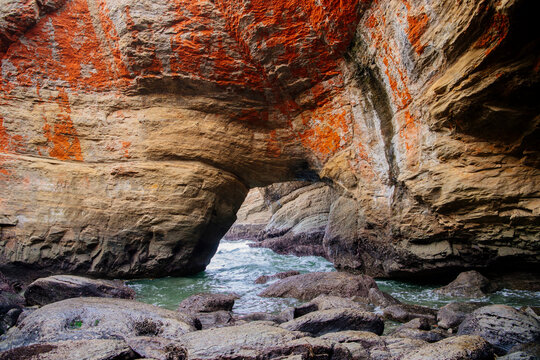 Rock arch formation at devils punch bowl along Oregon coastline