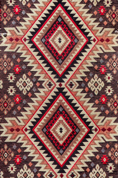 Woven rug with a red and cream geometric diamond pattern, Tbilisi, Georgia