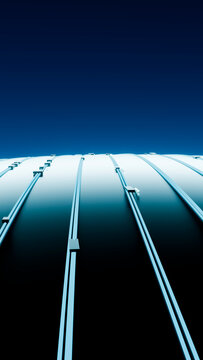 Curved metal dome with blue structural ribs under clear sky