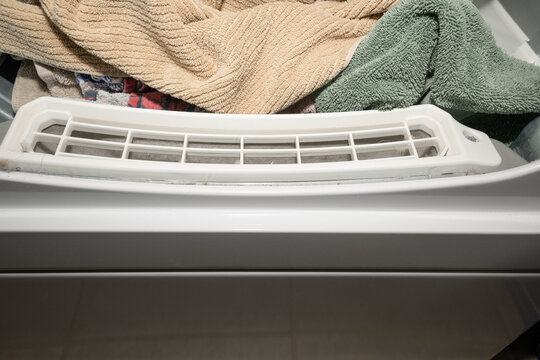 Used, dirty, dryer lint screen, filter, trap after drying a load of towels.