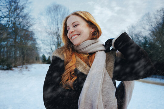 Three women enjoy snow and sunshine outdoors