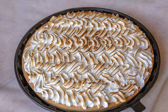 Baked Pie With Meringue Topping on a Table
