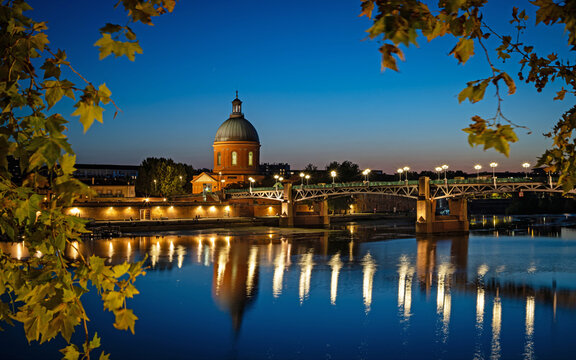 Toulouse, France - September 20, 2026: The illuminated Saint-Pierre Bridge and the Dome de la Grave in Toulouse at Blue Hour
