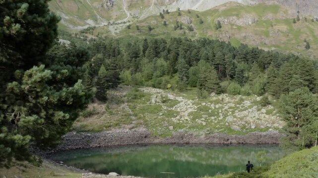 Aerial pullback from a small mountain lake surrounded by forest in Artvin, Turkey