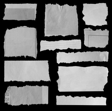 Torn papers on black