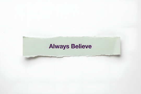 Inspiring Quote Always Believe Written on torn paper with white background.