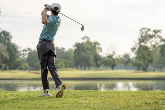  Professinal golf player on golf course. Pro golfer taking a shot. sport, golf, golfer, golfing, club,