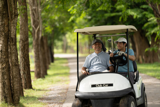 Active aging and golf friendship concept. Happy senior golfer shakes hands with a younger man on a green golf course, celebrating a friendly game. Golf, senior, handshake, friendship, sports.