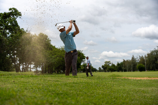 Professinal golf player on golf course. Pro golfer taking a shot. sport, golf, golfer, golfing, club,	