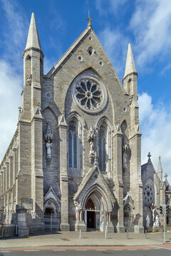 Historic facade of St. Mary of the Angels Church in Dublin, Ireland. Beautiful gothic revival architecture under a bright sky