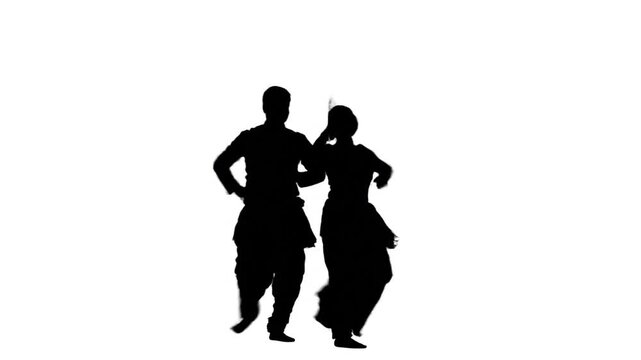 Silhouettes of a man and woman performing a traditional dance against a clean white background.
