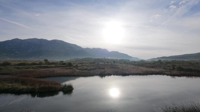 Wetland Reflections and Clouds in a Time-Lapse Sequence