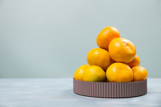 Mandarin, tangerine or clementine citrus fruit, juicy ripe fruits, healthy organic food, vitamin booster, fitness and lifestyle concept, harvest in winter season