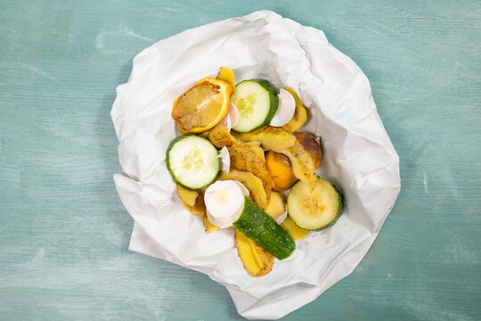 Organic food waste, compost of scraps and peelings of potatoes, cucumbers, eggshells and a rotten lemon fruit, zero garbage, leftovers, recycling and envirionment concept