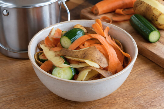 Carrot and Potato Peelings Collected in a Ceramic Bowl