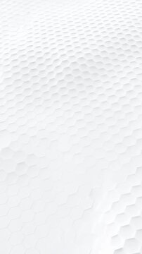 White honeycomb cells shift gradually across a raised geometric surface. Technology presentations, engineering branding, and website hero.