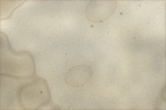 Vintage aged paper texture featuring stained parchment surface with realistic coffee ring marks and fine scratches for antique graphic design background projects