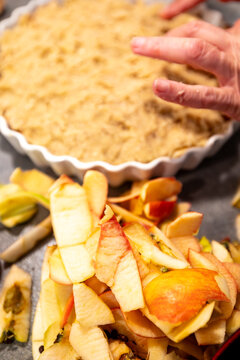 Stockholm, Sweden A cook in a residential kitchen puts the final touches on the crust of an upside-down apple pie with her fingers.