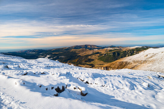 Majestic view from snowy Bucegi plateau in Carpathian Mountains, Romania on a sunny day in late October.