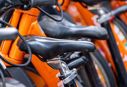 Orange rental bicycles for urban ride sharing