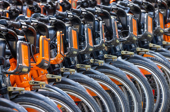 Rows of rental bicycles for urban ride sharing