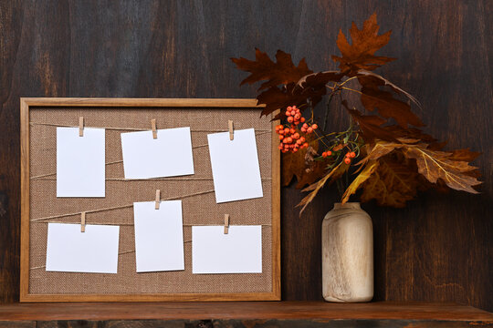 Arrangement of picture frame and autumnal bouquet
