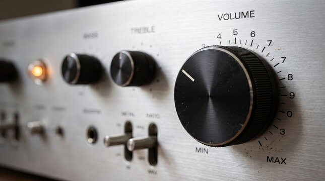 Close up of an audio amplifier control panel with volume knob and switches equipment electronics hardware indicator receiver component