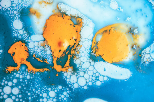 Abstract blue and orange oil and water bubble texture