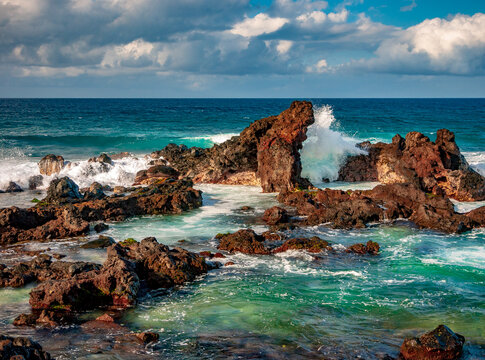 Waves crash on the rocky north shore of Maui, Hawaii